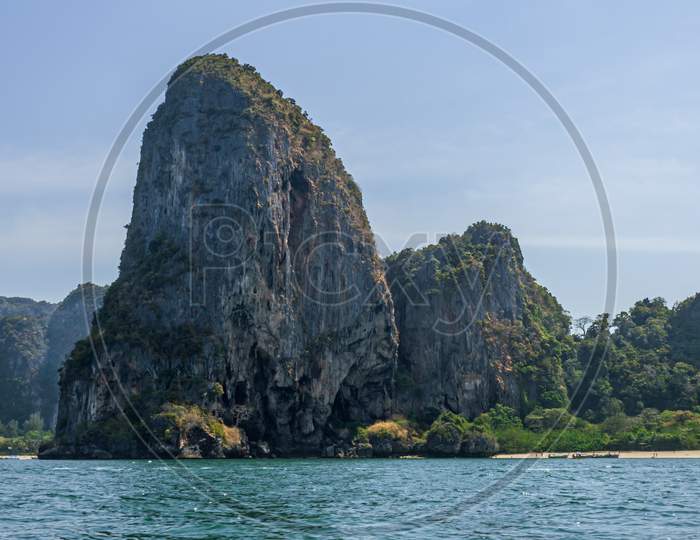 Thailand Island Beach And Large Rock View From Sea