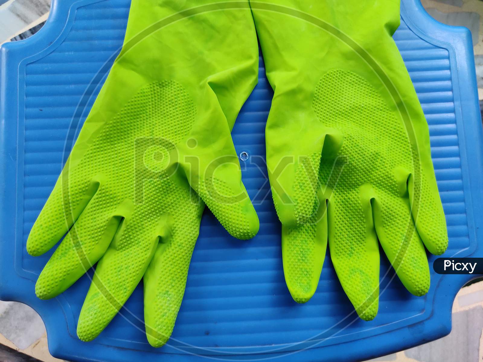Gloves for protect hand against COVID-19 on blue background