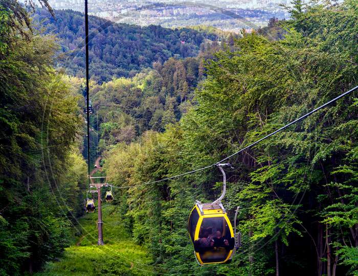 Bielsko Biala, South Poland: Moving Cable Car Trolley Through Forest And Hills Carrying Passengers