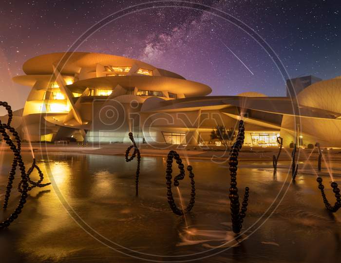 National Museum of Qatar (Desert rose) exterior  night view with fountain in foreground