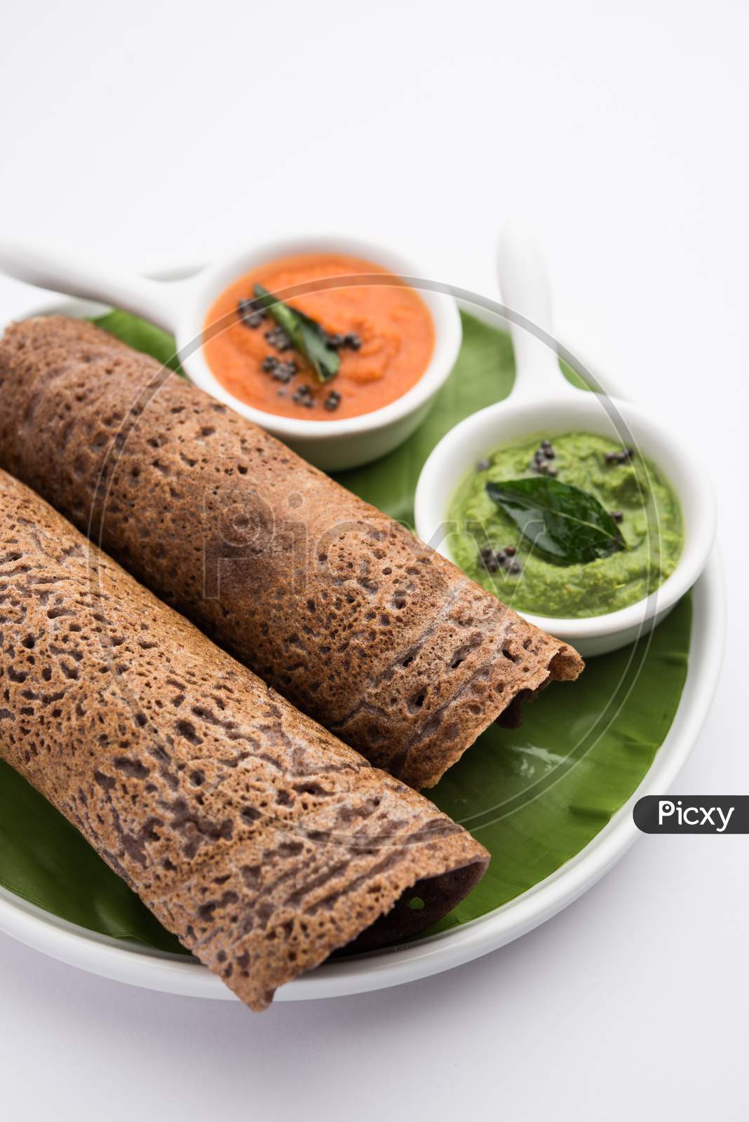 Ragi Dosa Made Using Batter Of Finger Millet Is A Healthy Indian Breakfast Served With Chutney