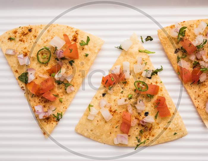 Indian Snack Masala Papad / Papadum, Fried Or Roasted With Spicy Onion And Tomato Salad