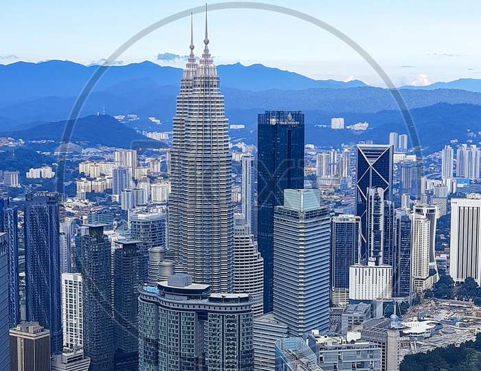 Cityscape of Kuala Lumpur with iconic buildings such as Petronas Twin Tower. Aerial view from KL Tower in Kuala Lumpur Malaysia