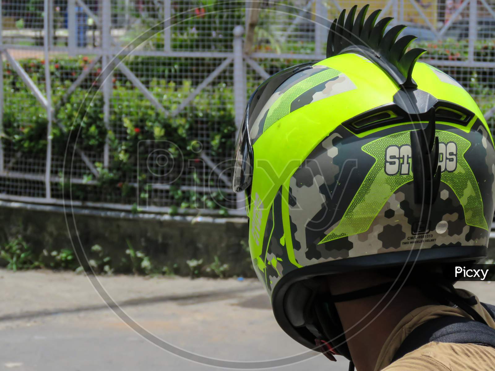 Boy Waring Stylist Green Helmet.