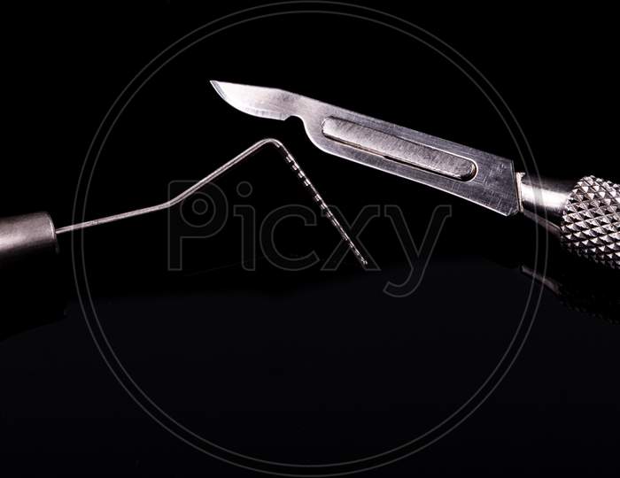 Closeup Of Professional Dental Tools. Periodontal Probe And Scalpel.