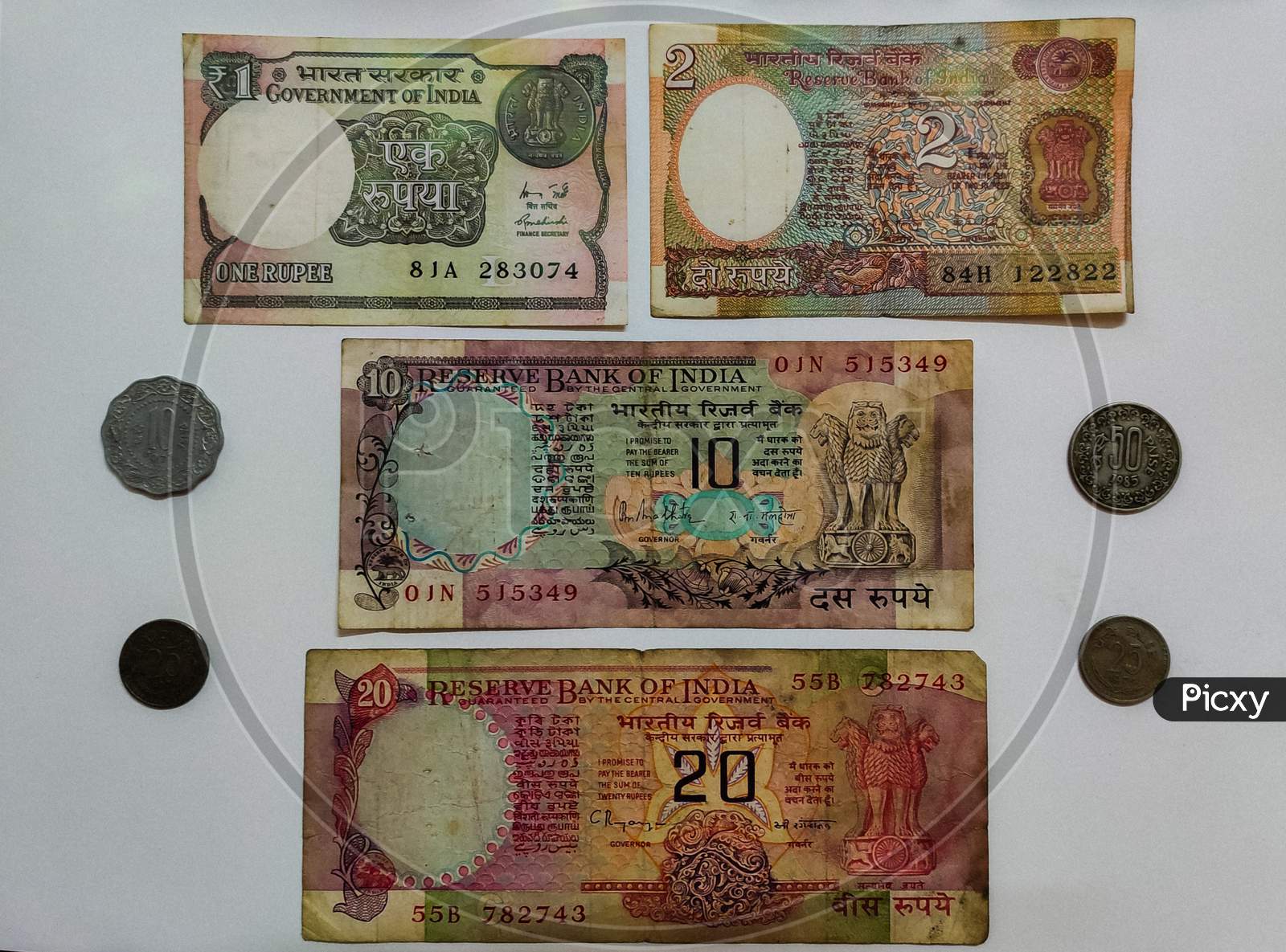 Collection of old currency notes and coins of India.