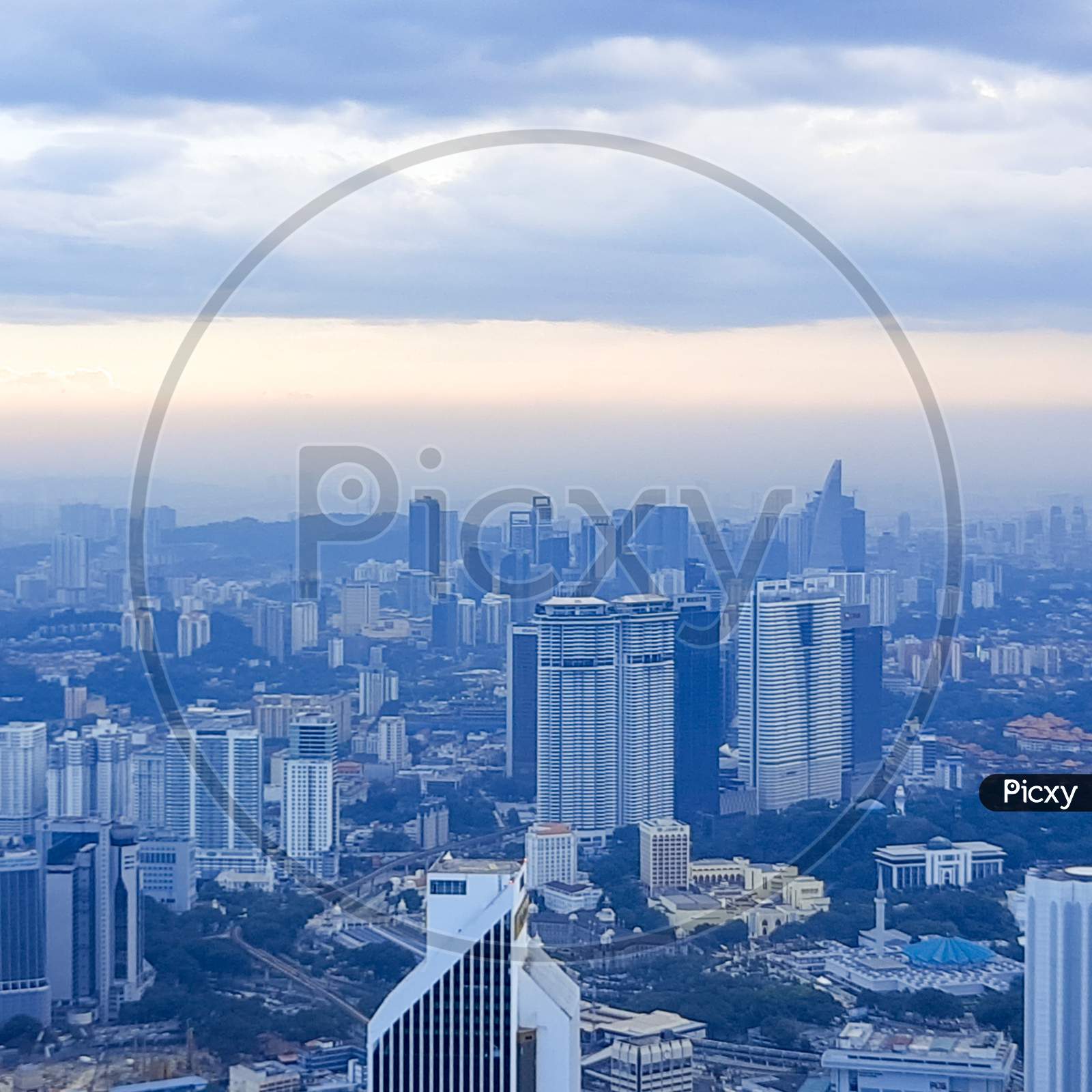 Cityscape of Kuala Lumpur with iconic buildings such as Petronas Twin Tower. Aerial view from KL Tower in Kuala Lumpur Malaysia