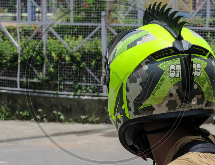 Boy Waring Stylist Green Helmet.