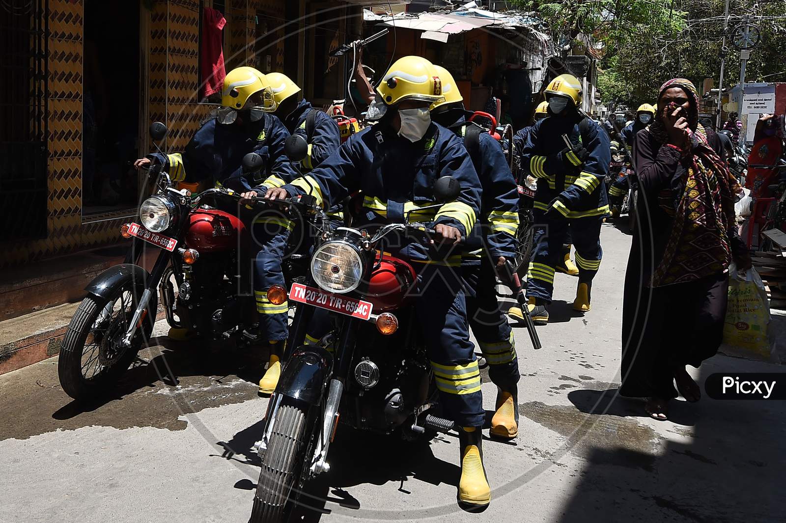 Firefighters equipped with disinfectants assemble in a containment zone during the lockdown in Chennai on July 04, 2020.