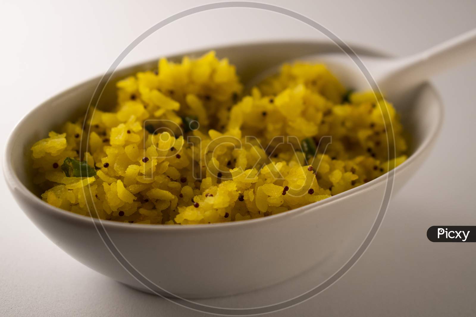 Indian breakfast poha in a bowl.