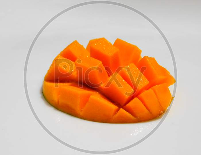 Carved mangoes isolated on a white background,Ripen Half Mango with square design.