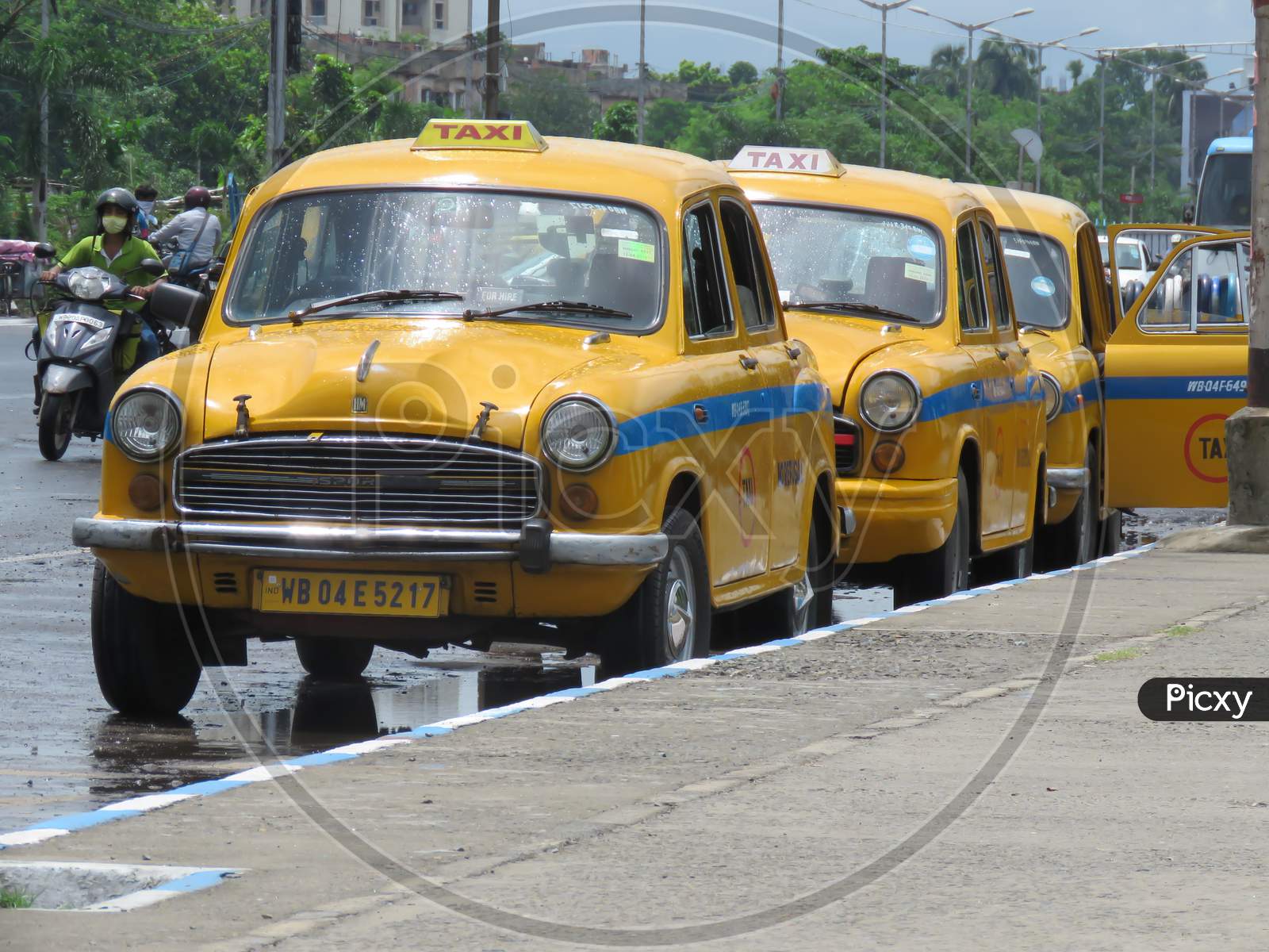 Line Of Yellow Taxi At Road.
