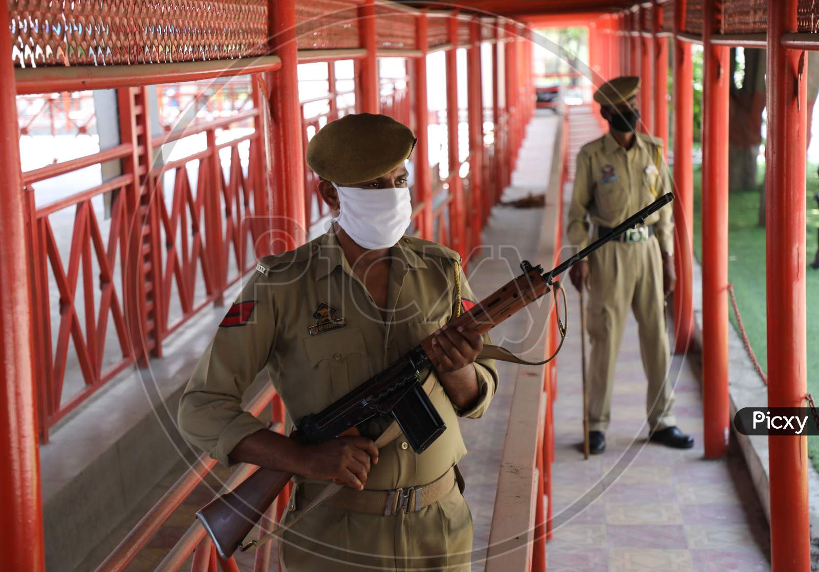 Security personnel stand guard at the base camp of Amarnath Yatra in Jammu on July 05, 2020