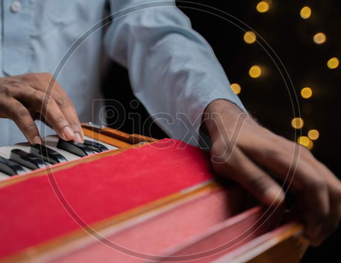 Hands Playing Indian Music Instrument Harmonium In Music Concert