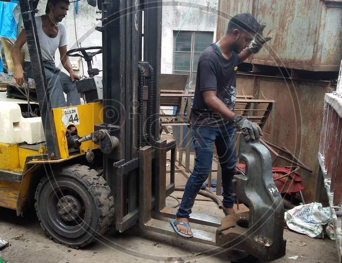 Working forklift truck in people working