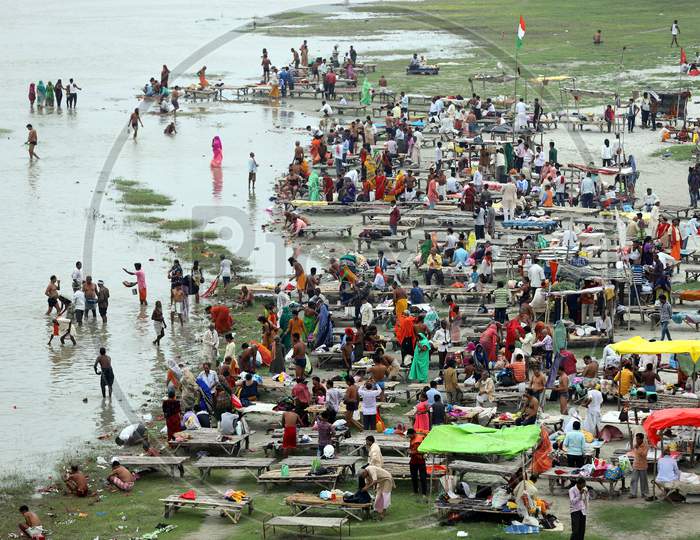 Devotees take a holy dip in the Holy river Ganga on the occasion of Guru Purnima  in Prayagraj, Uttar Pradesh on July 07, 2020