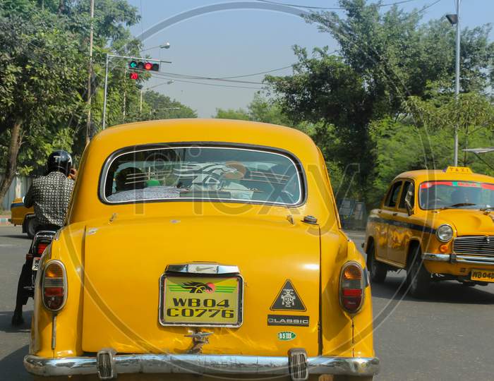 Yellow Taxis in Kolkata cityscape of India.