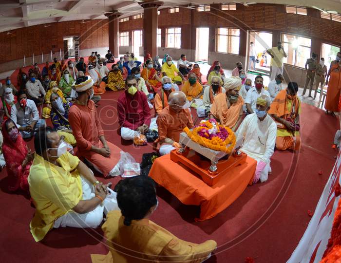 Followers of Swam Vasudevanand Saraswati listen to his sermons on the occasion of Guru Purnima in Prayagraj, Uttar Pradesh on July 07, 2020
