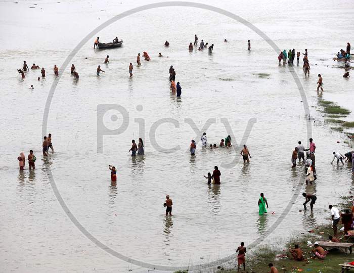 Devotees take a holy dip in the Holy river Ganga on the occasion of Guru Purnima  in Prayagraj, Uttar Pradesh on July 07, 2020