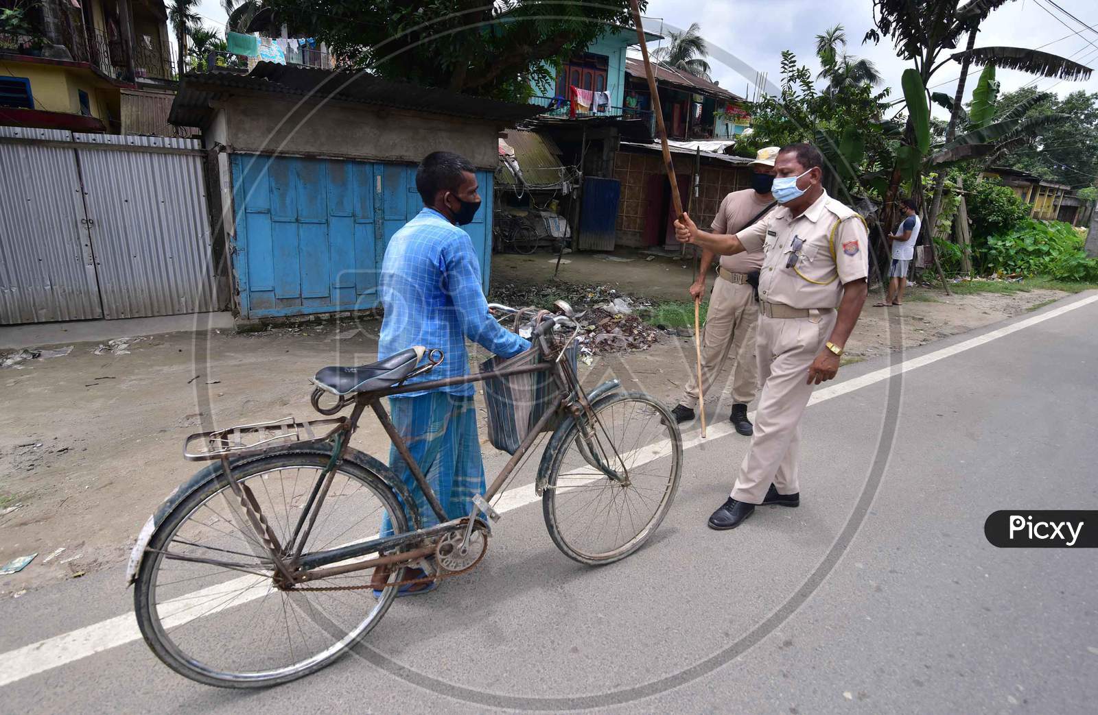 Police questioning a person  during the lockdown imposed to curb the spread of Coronavirus in Nagaon, Assam on July 05, 2020