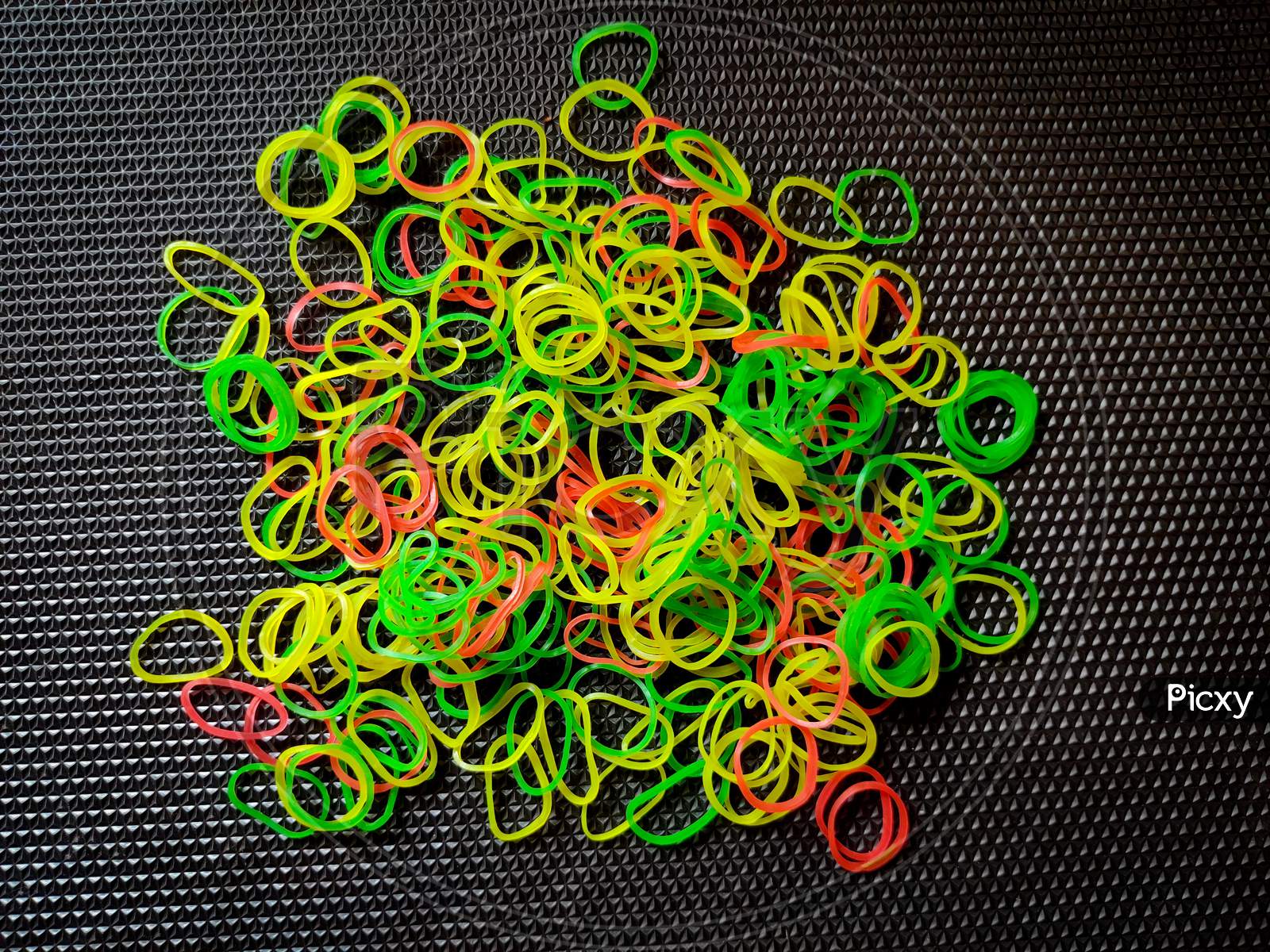Bunch Of Color Rubber Bands Isolated On Black Background.