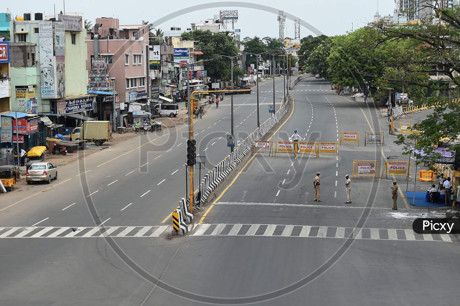 Police place barricades on a deserted road during the lockdown in Chennai on July 07, 2020