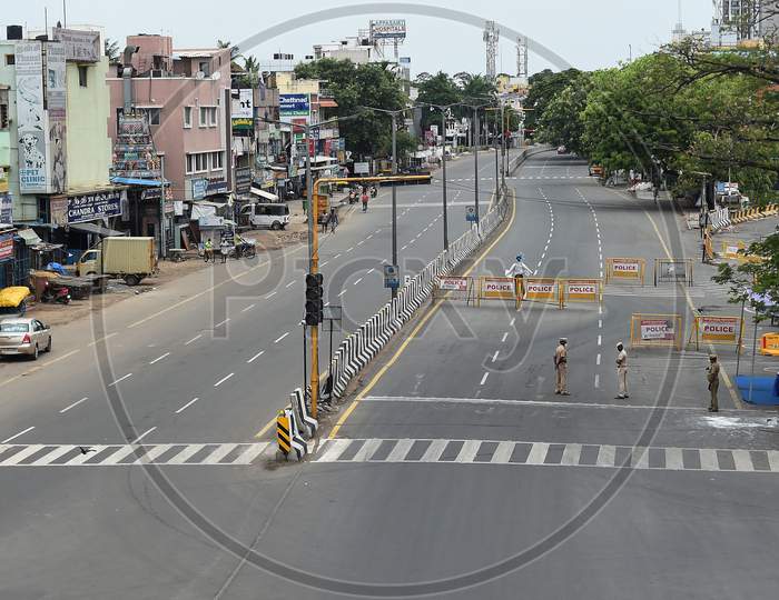Police place barricades on a deserted road during the lockdown in Chennai on July 07, 2020