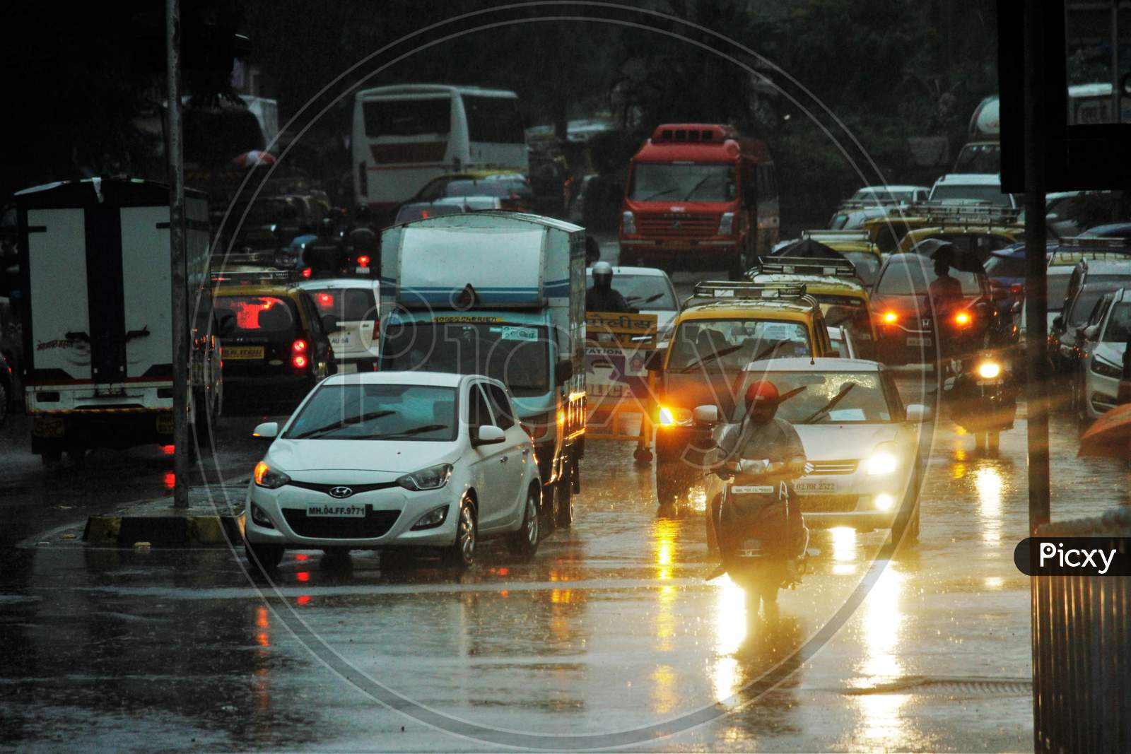 Traffic is seen on a road during heavy rains, in Mumbai on July 4, 2020.