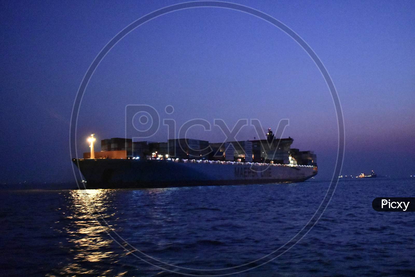 Merchant Ship Returning To A Port In Evening.
