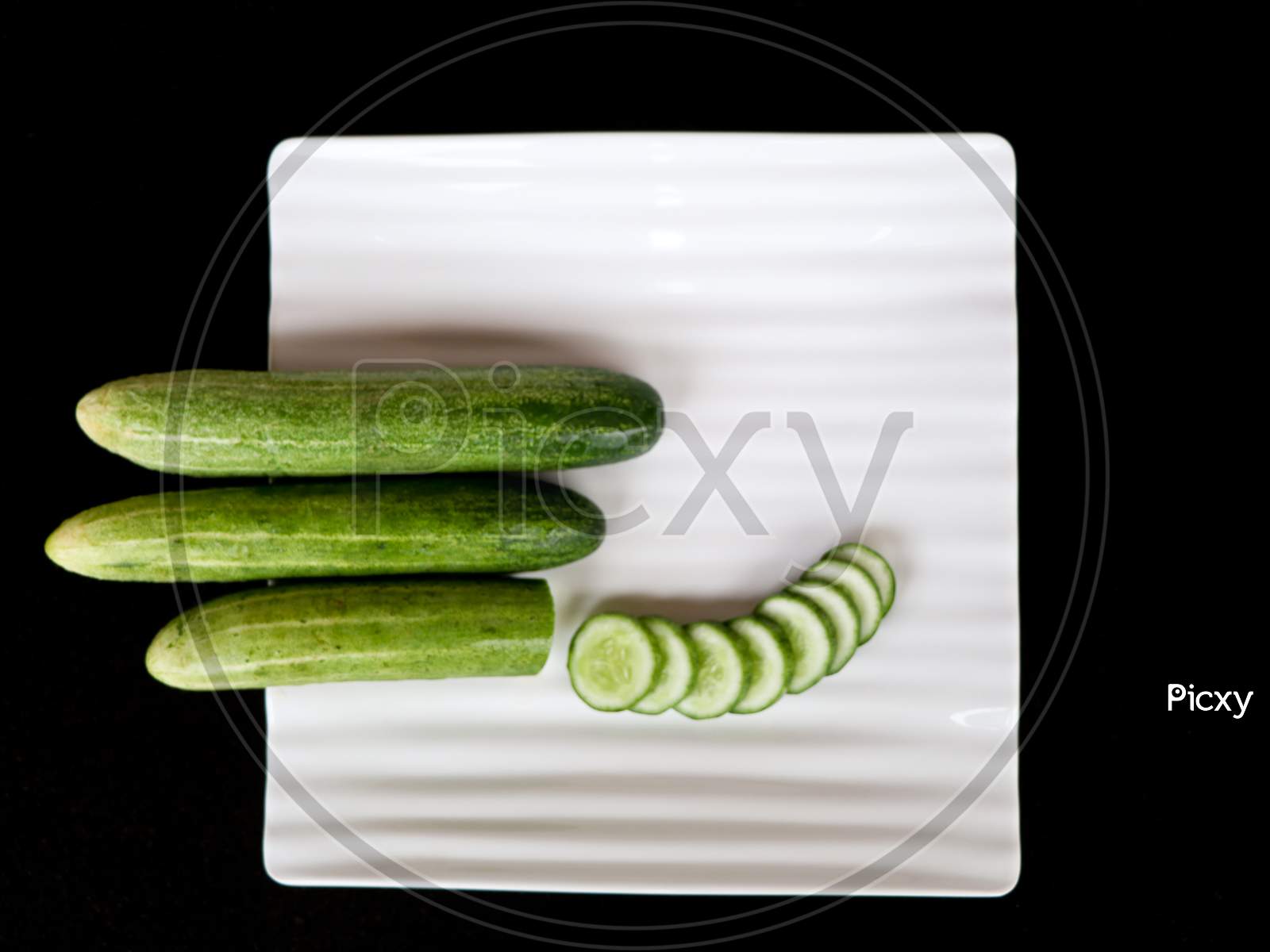 Fresh Raw Cucumber With Sliced Ones