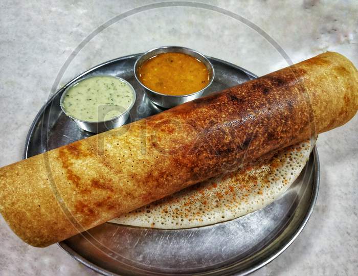 Masala Dosa With Chutney And Sambar Placed In A Steel Plate On A White Table. South Indian Breakfast.