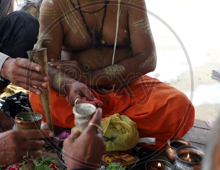 Hindu devotees offer prayers on the first Monday of the Sravan month on the banks of the River Ganga in Prayagraj, Uttar Pradesh on July 06, 2020