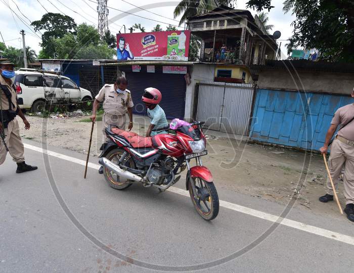 Police question a bike rider during the lockdown imposed to curb the spread of Coronavirus in Nagaon, Assam on July 05, 2020