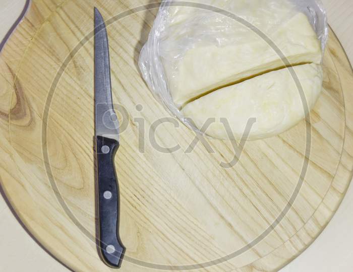 Selective Focus Knife And Dough On The Chopping Board
