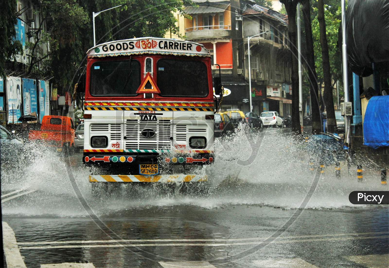 A truck drives through a waterlogged street during heavy rains, in Mumbai on July 4, 2020.