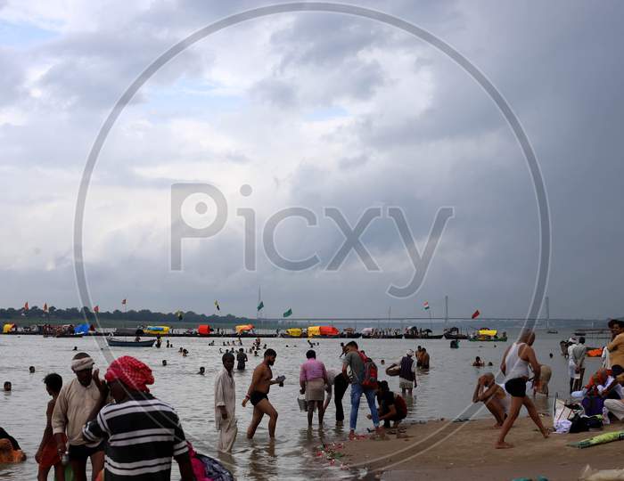 People taking a dip in the holy waters of River Ganga in Prayagraj, Uttar Pradesh on July 07, 2020