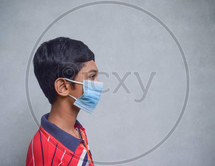 Kid Wearing Face Mask For Covid-19 Corona Virus Disease Protection