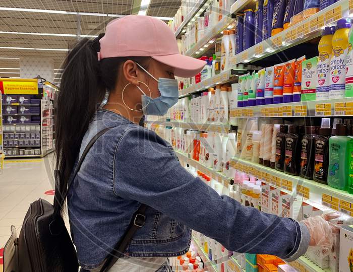 Young Asian Girl Wearing Face Mask And Protective Equipment During Covid-19 Pandemic.