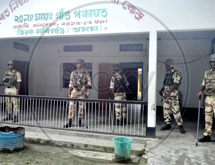 Indian security personnel stand guard