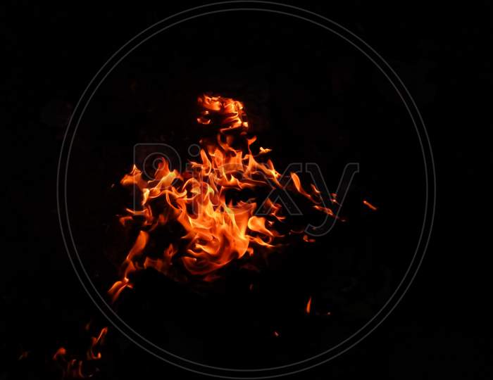 Fire shapes, burning fire black background.