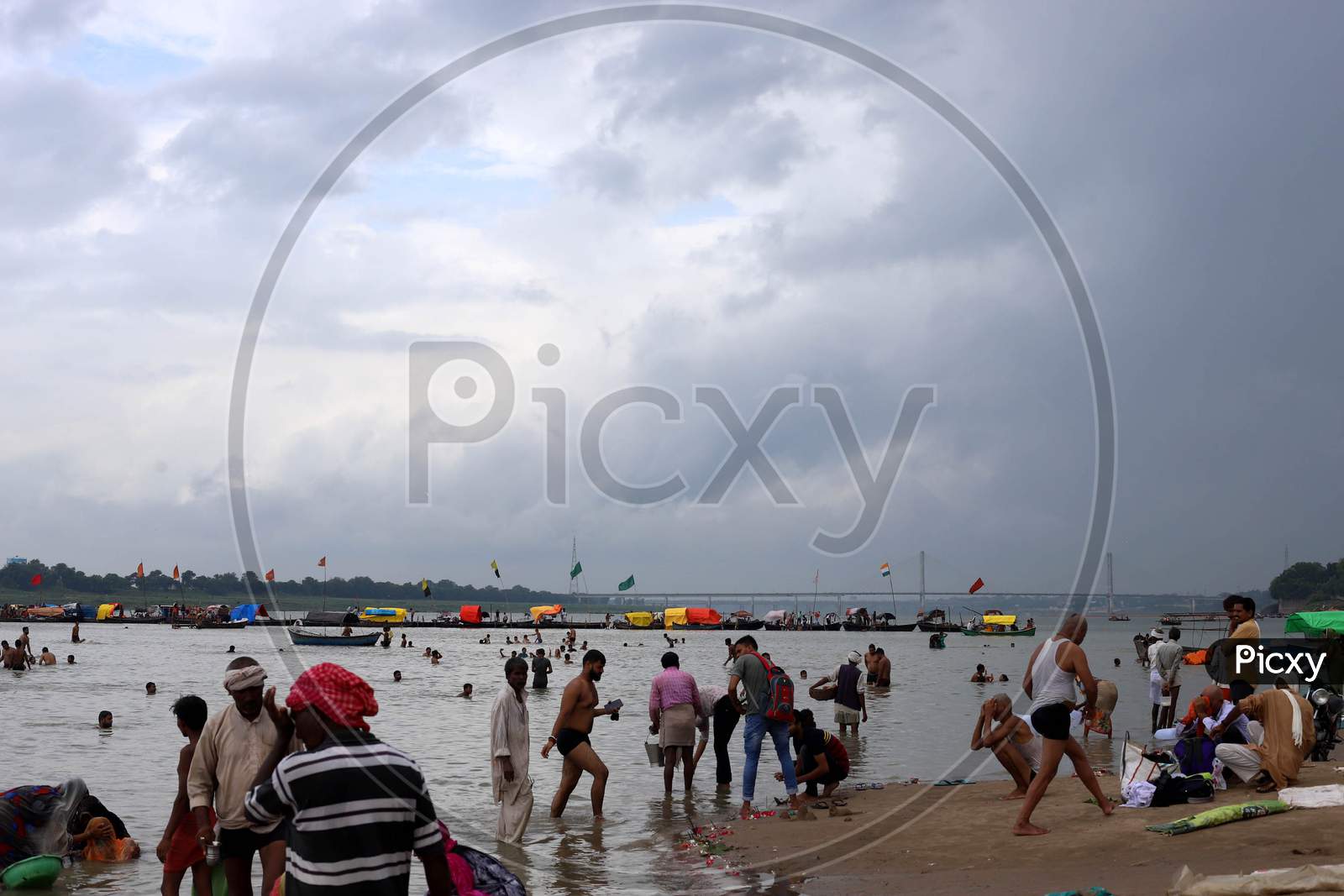 People taking a dip in the holy waters of River Ganga in Prayagraj, Uttar Pradesh on July 07, 2020