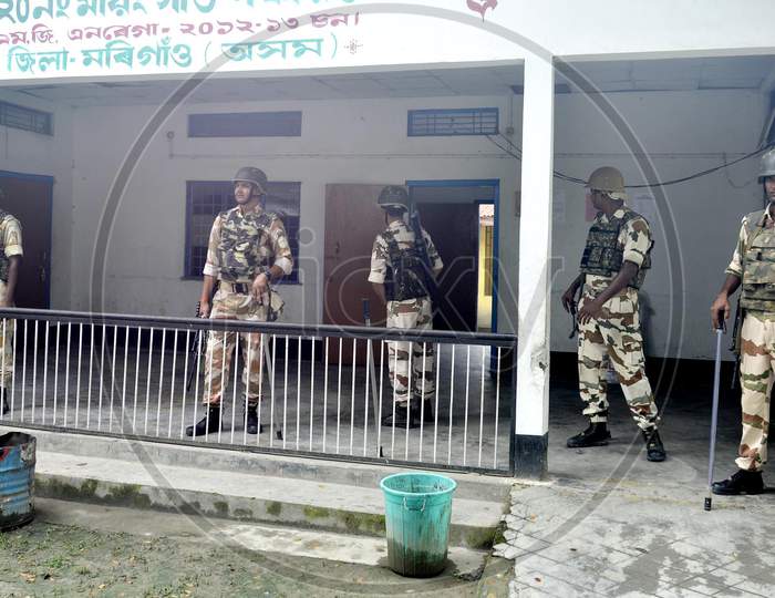 Indian security personnel stand guard