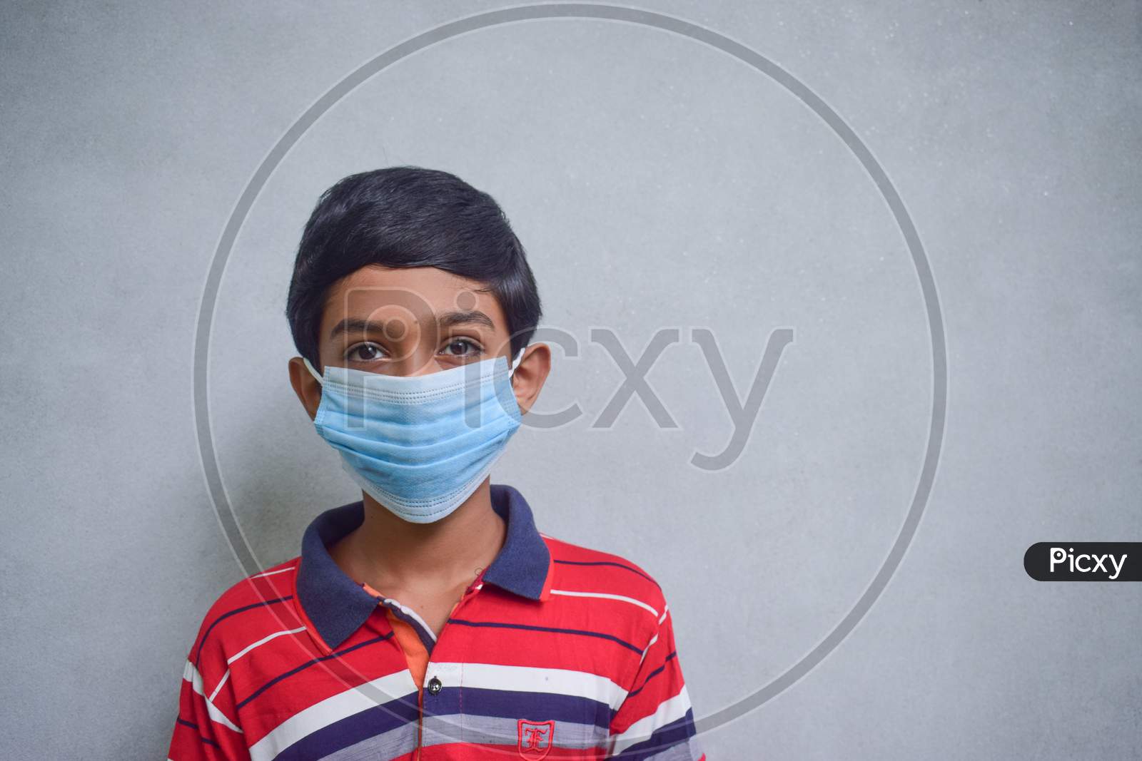 Kid Wearing Face Mask For Covid-19 Corona Virus Disease Protection