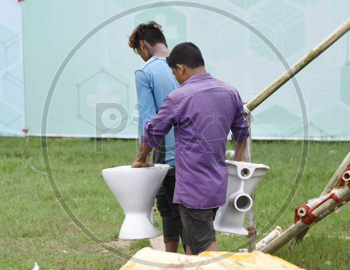 Workers carry materials  prepare a makeshift quarantine centre