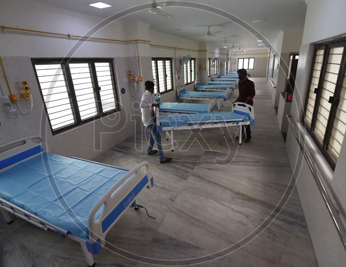 Health workers arrange beds to convert a building which belonged to the National Institute of Ageing into a dedicated Covid-19 Care Centre in Chennai, TamilNadu on July 07, 2020