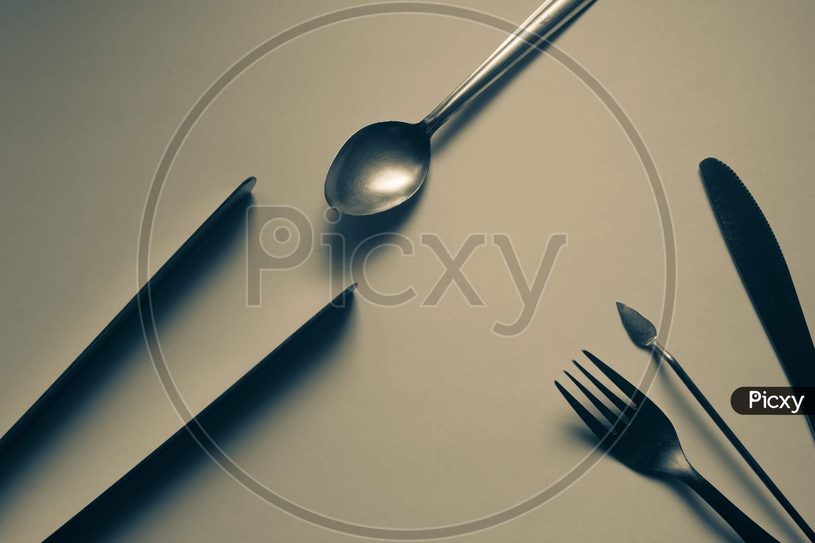 Cutlery Arranged Against White Background