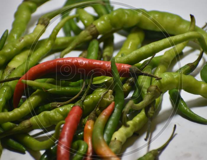 Green and red chilli peppers in Indian market