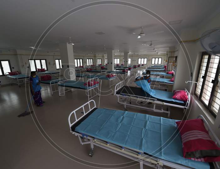 Health care workers arrange beds to convert a building which belonged to the National Institute of Ageing into a dedicated Covid-19 Care Centre in Chennai, Tamil Nadu on July 07, 2020
