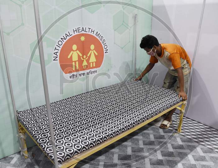 Workers prepare a quarantine center for COVID-19 patients
