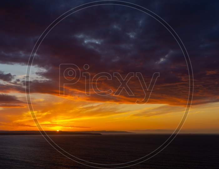The Sunsets Over The Sea Near Thornwick Bay, Flamborough Head, East Yorkshire, Uk